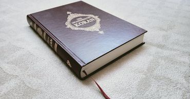 Qur’an placed on a table representing authentic Ruqyah therapy