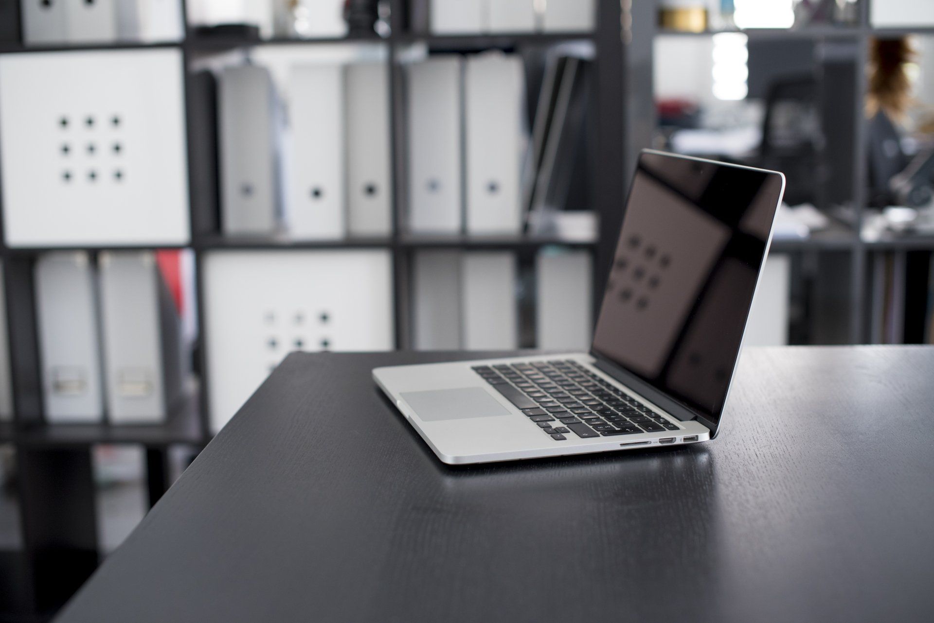 A Virtual Assistant working on a laptop for their client.