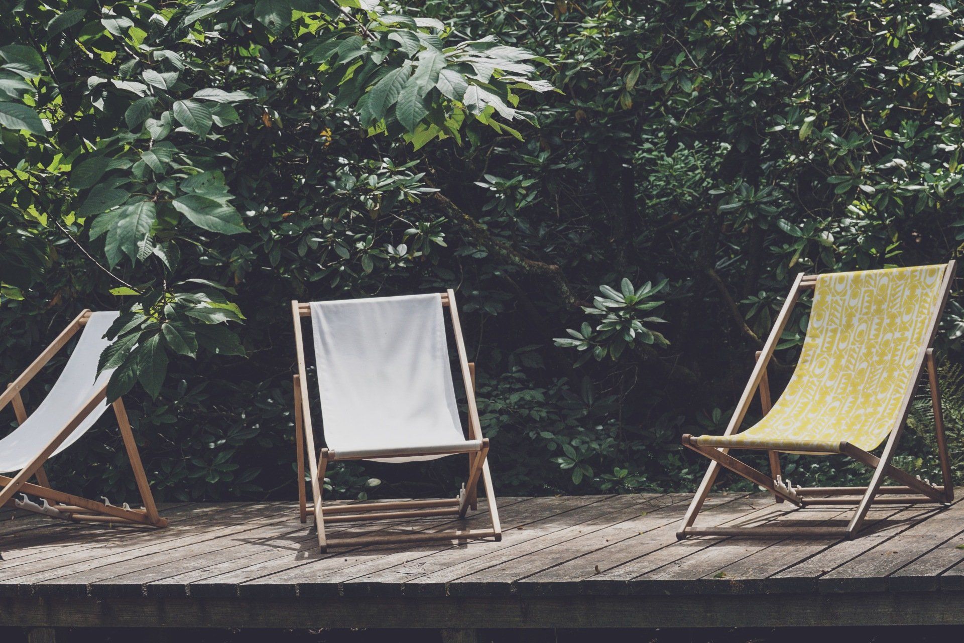 lawn chairs on a wooden patio