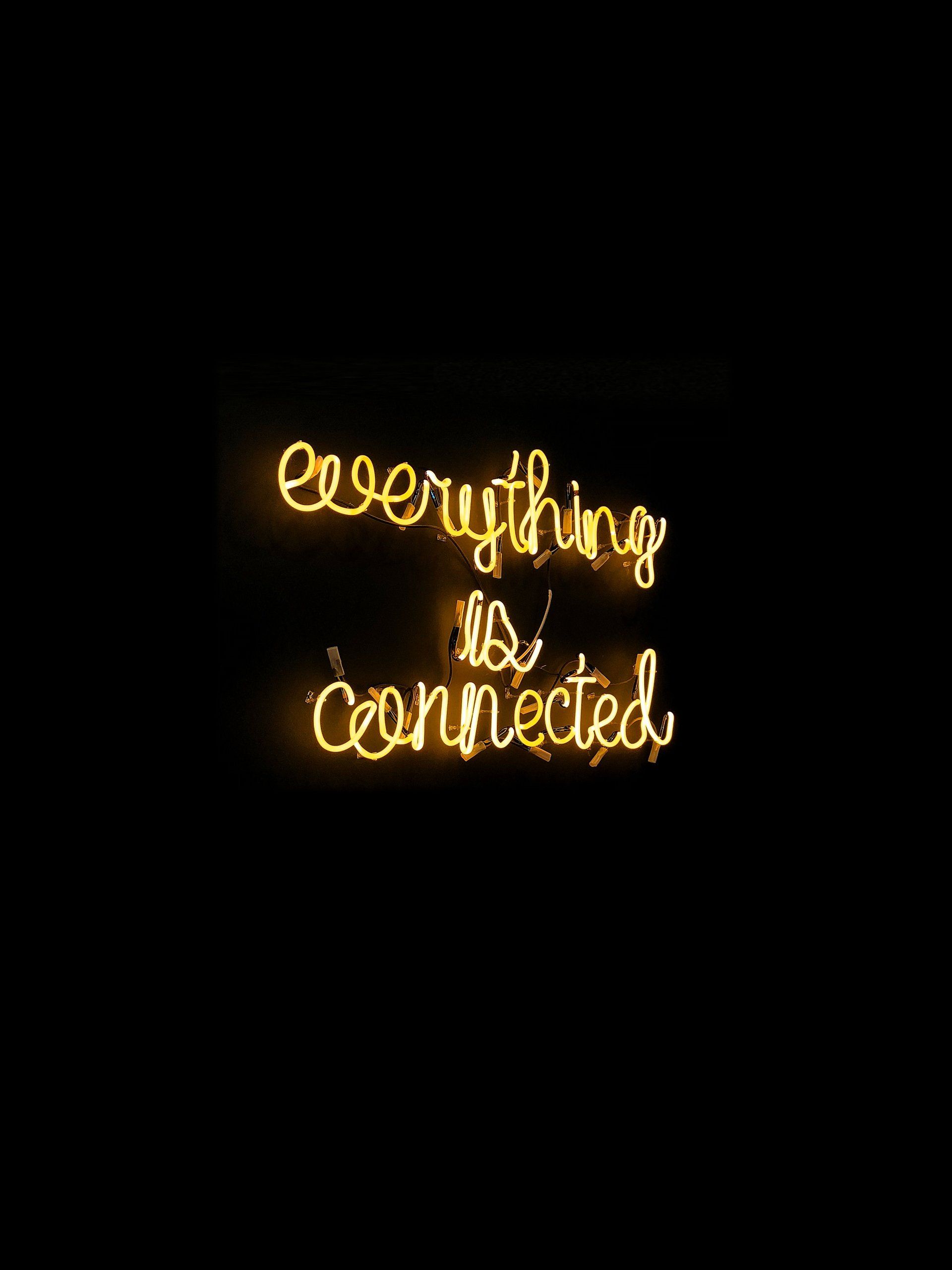 Neon light sign spelling Everything is connected