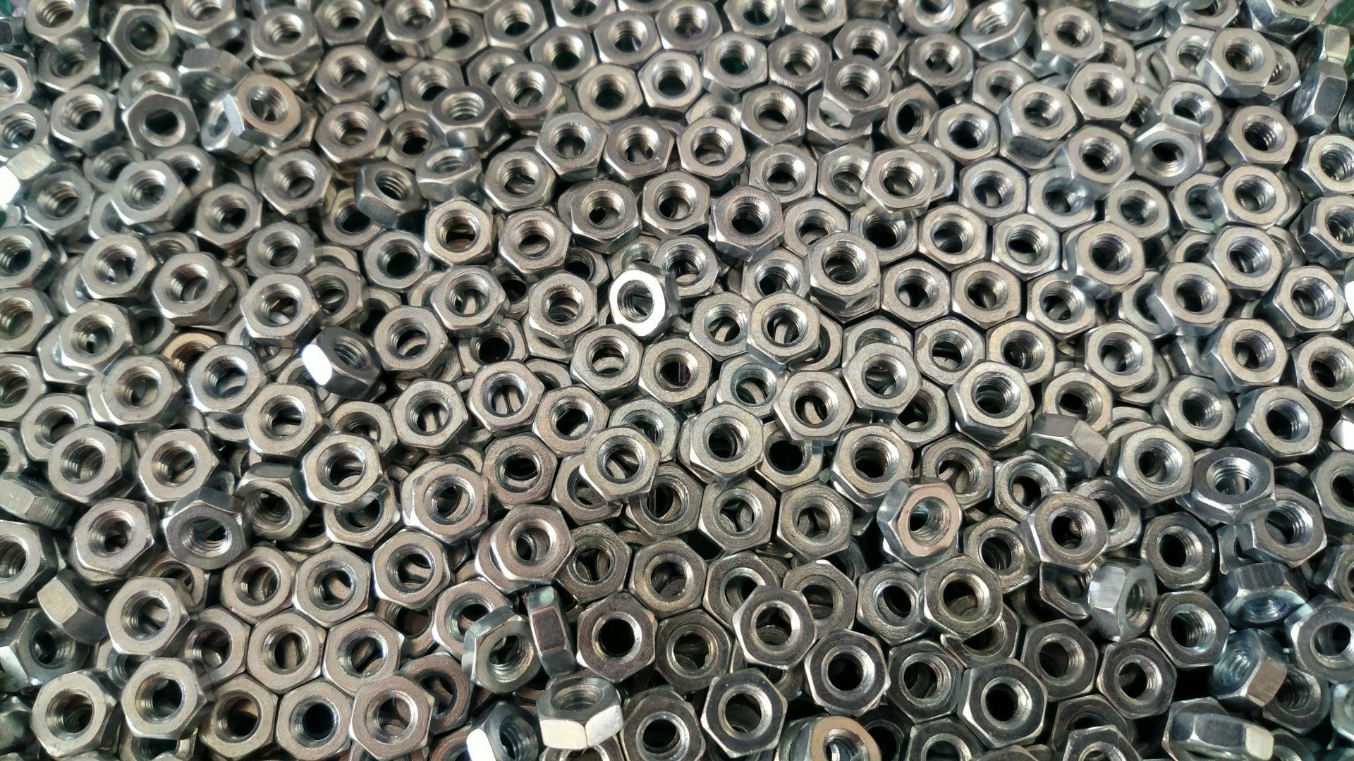 A pile of nuts sitting on top of each other on a table.