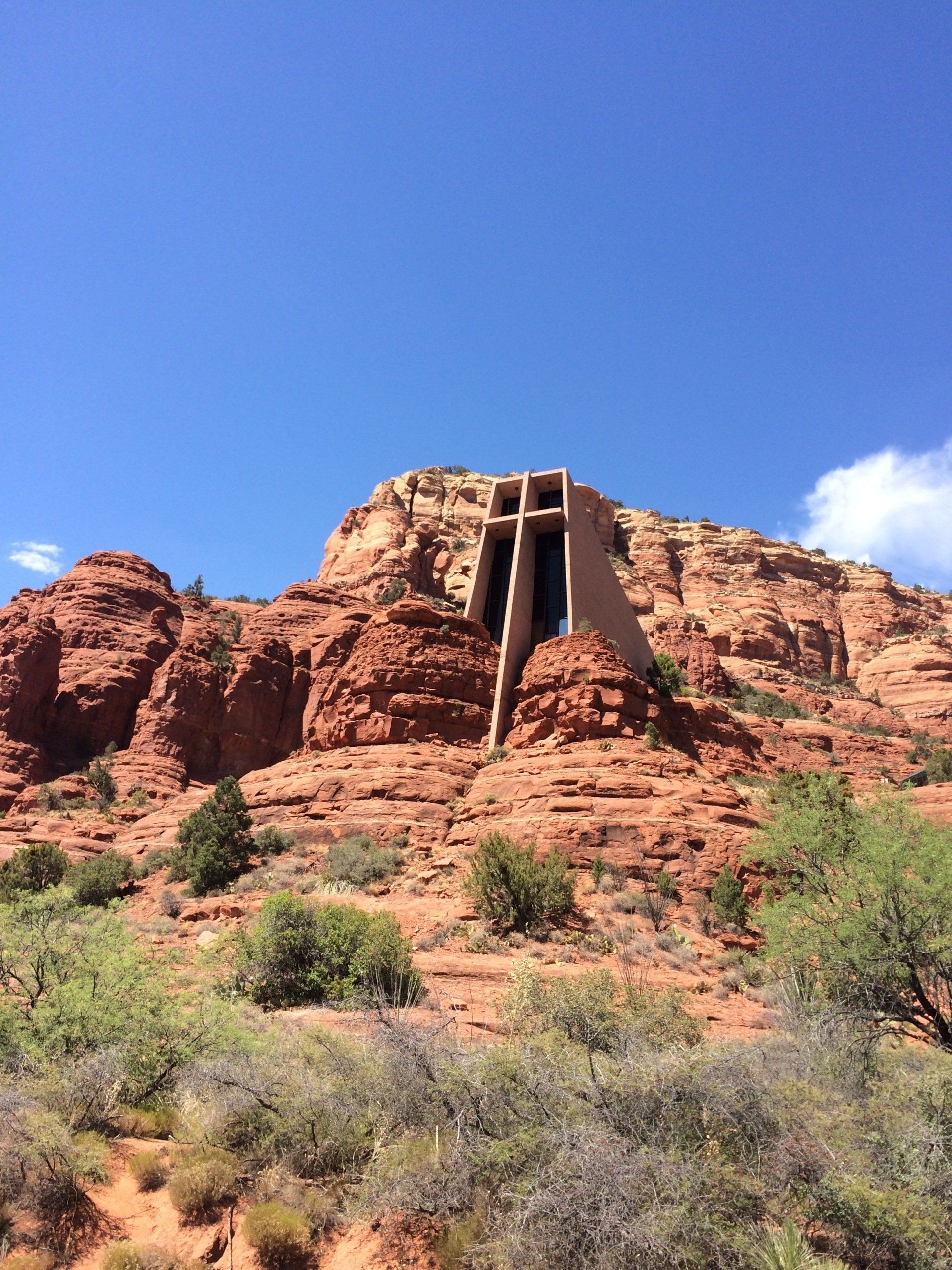 a large cross in the middle of a desert