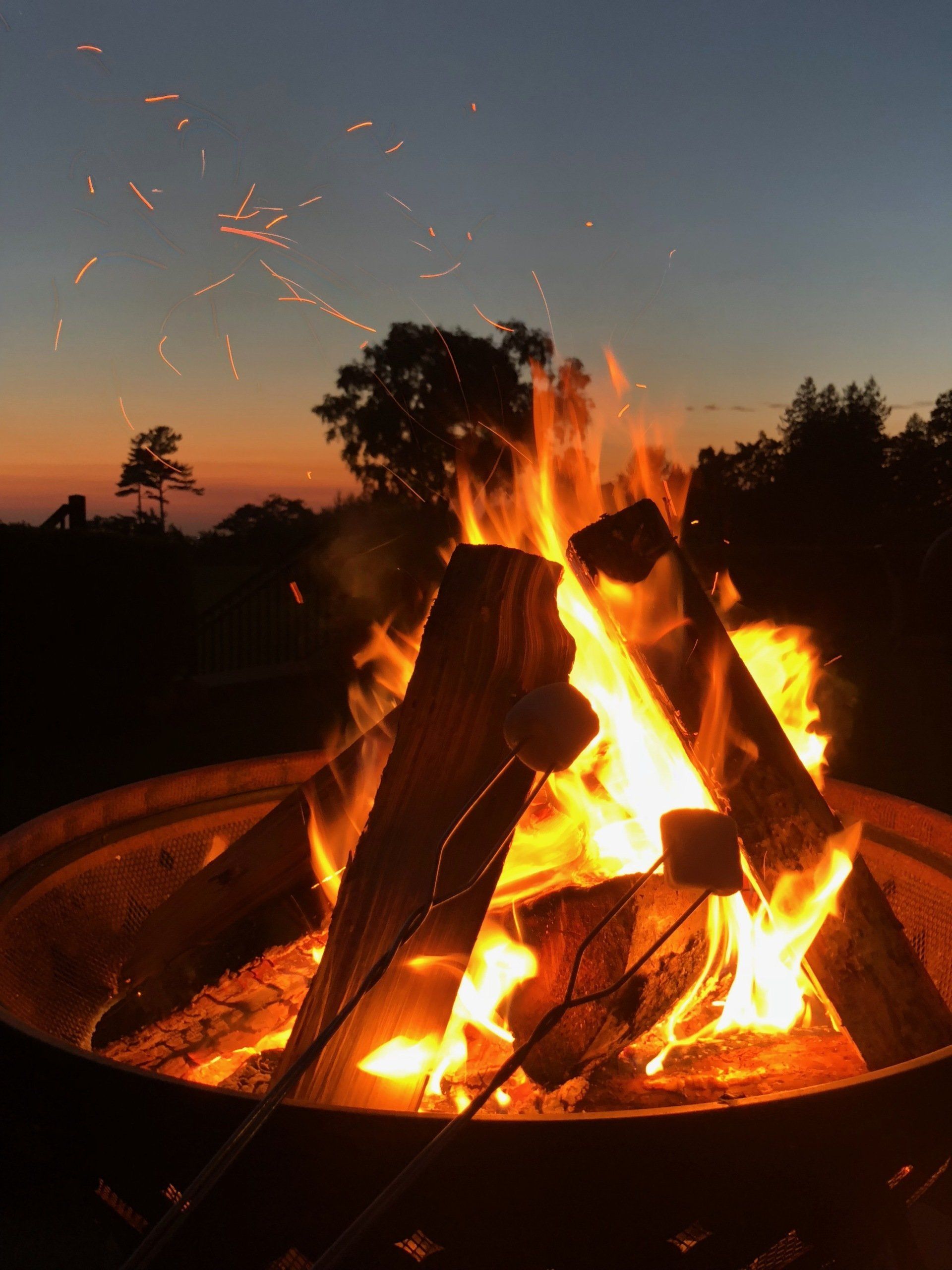 A close up of a bonfire in a pit