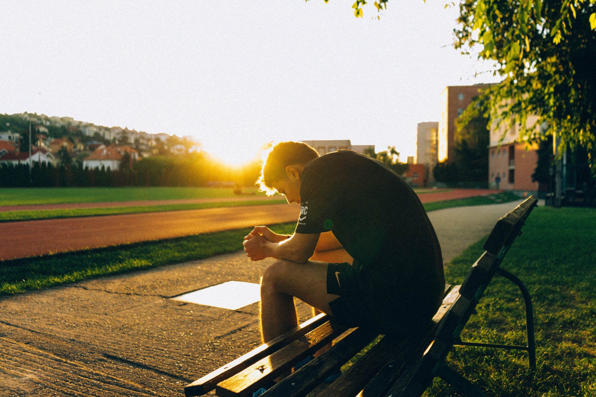 Nervous athlete sitting on a bench