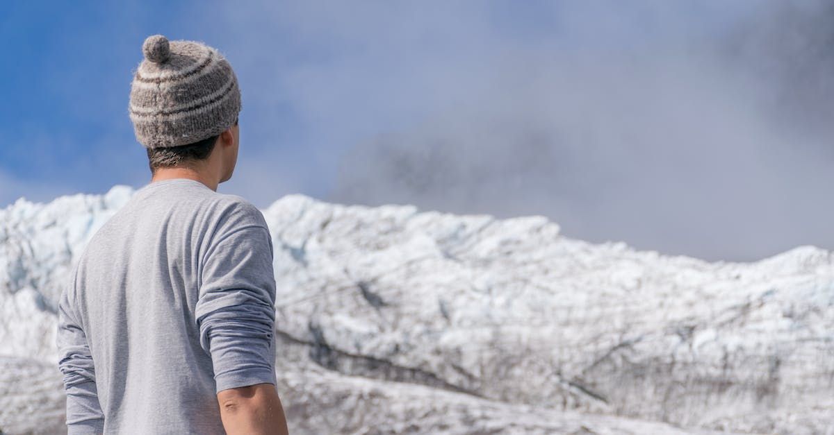 a man in front the andes mountain range