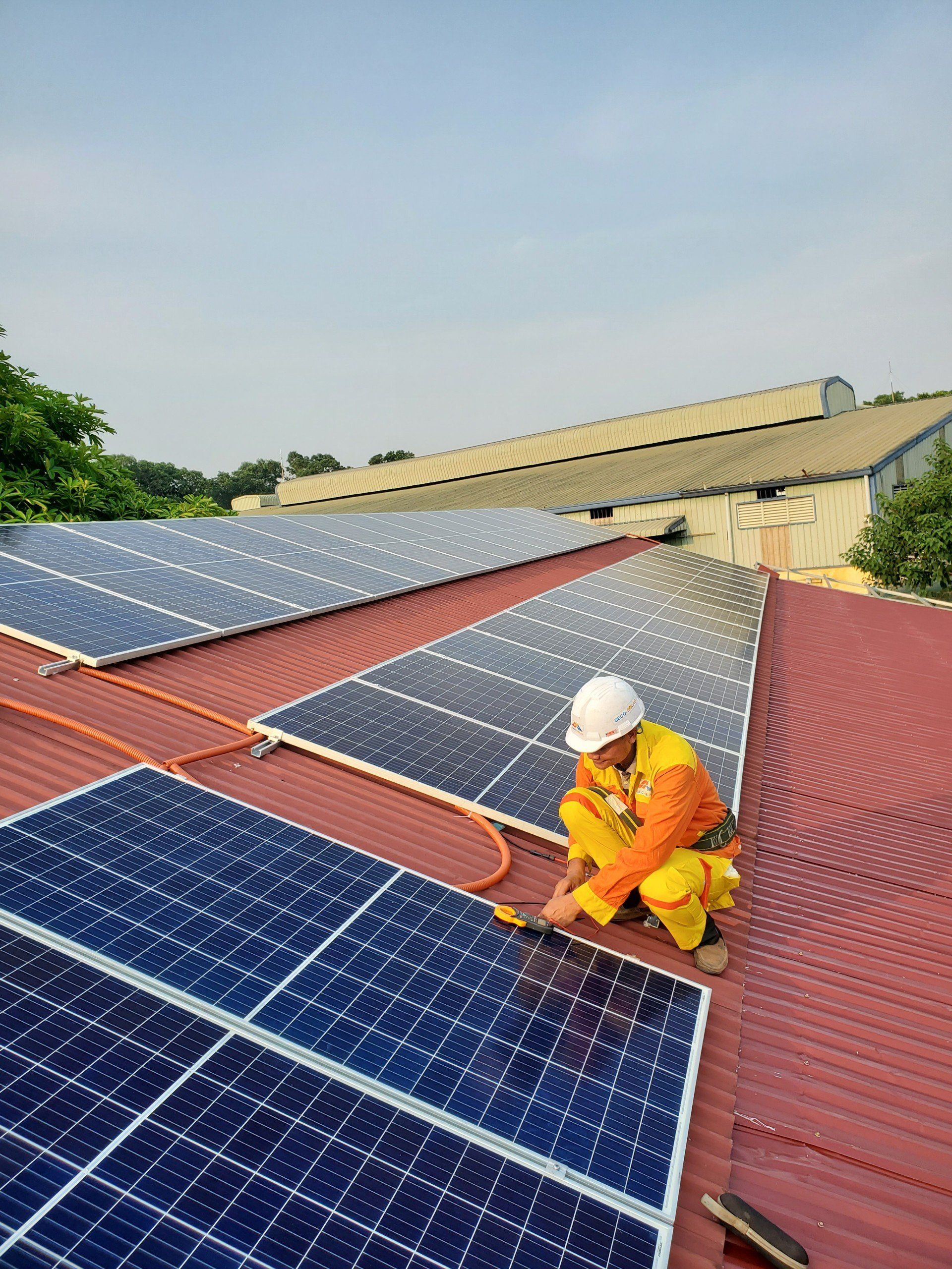 installing solar panels on rooftop