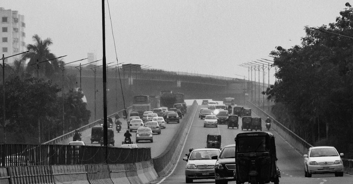 A black and white photo of a busy highway