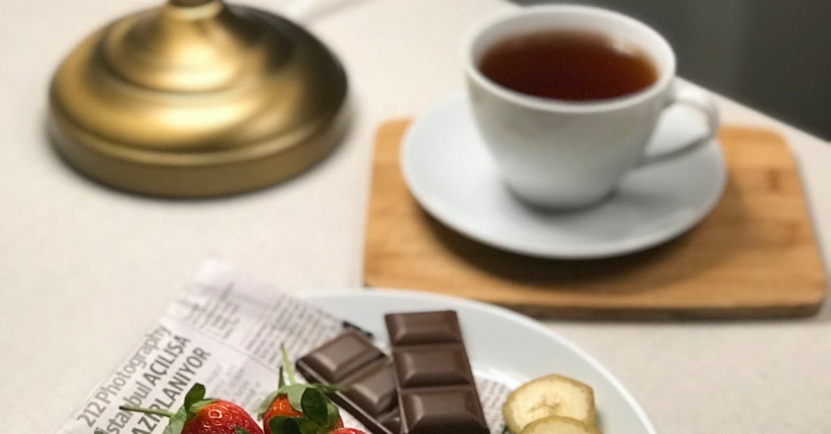 Image of a selection of treats - a mindful cup of tea, a taste of chocolate for a soothing mindful moment/