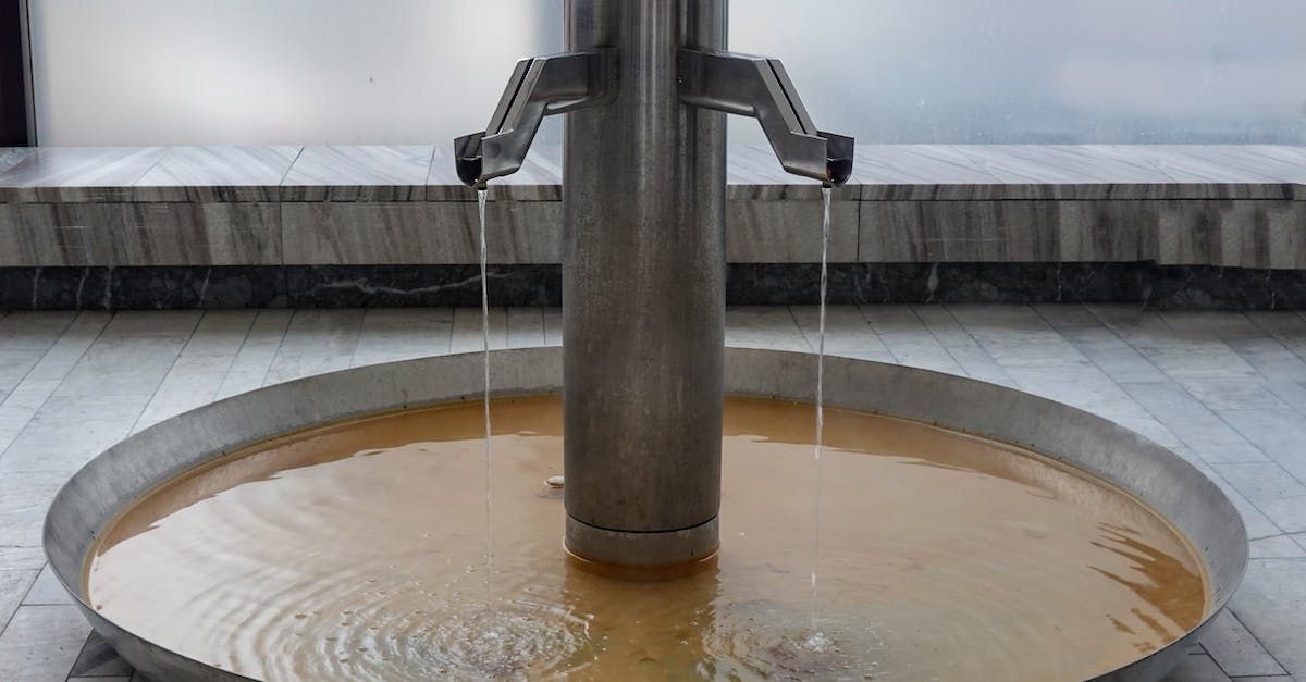 There is a fountain with water coming out of it.