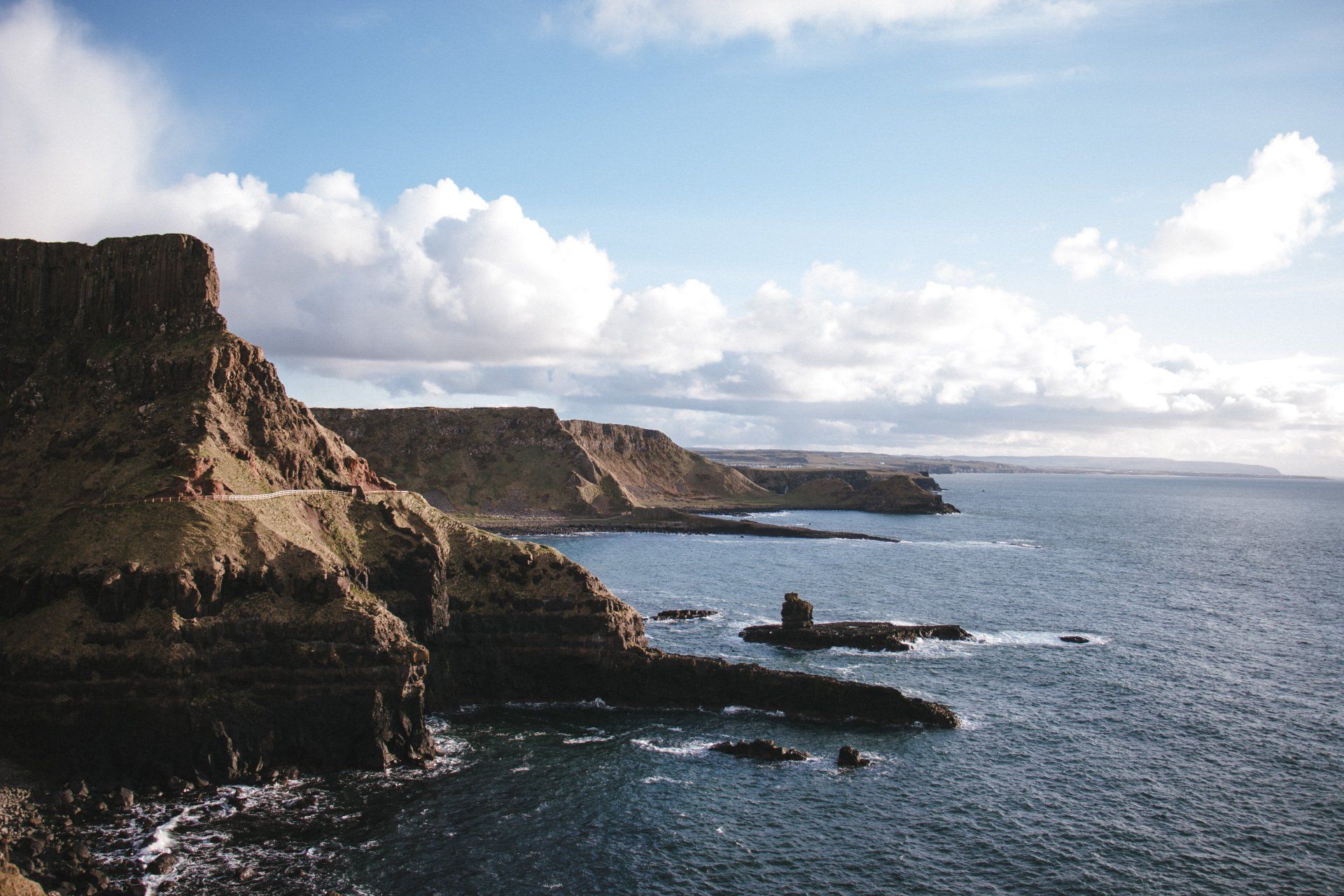 a large body of water surrounded by cliffs and rocks