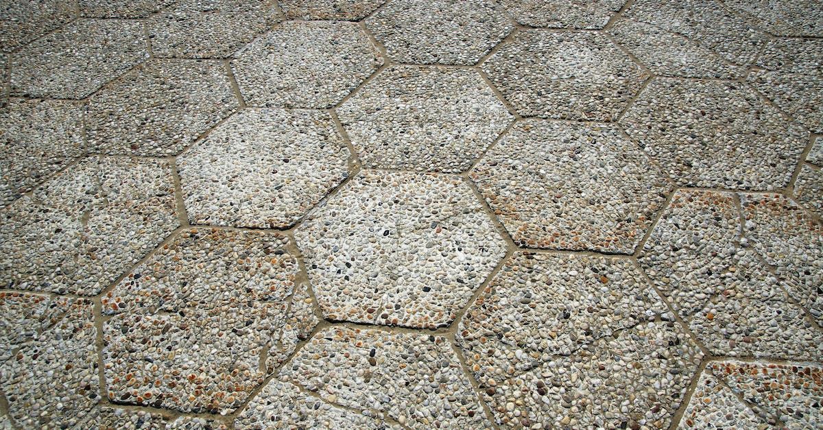 A close up of a brick wall with a honeycomb pattern.