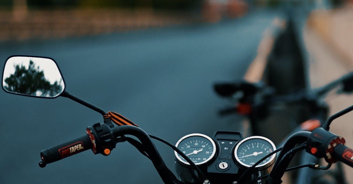 A motorcycle is parked on the side of the road.
