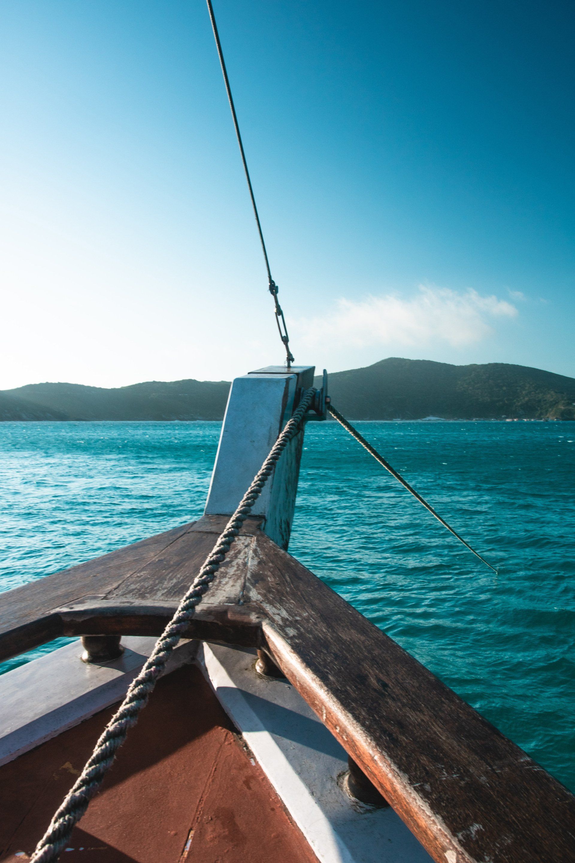 A boat is floating on top of a body of water