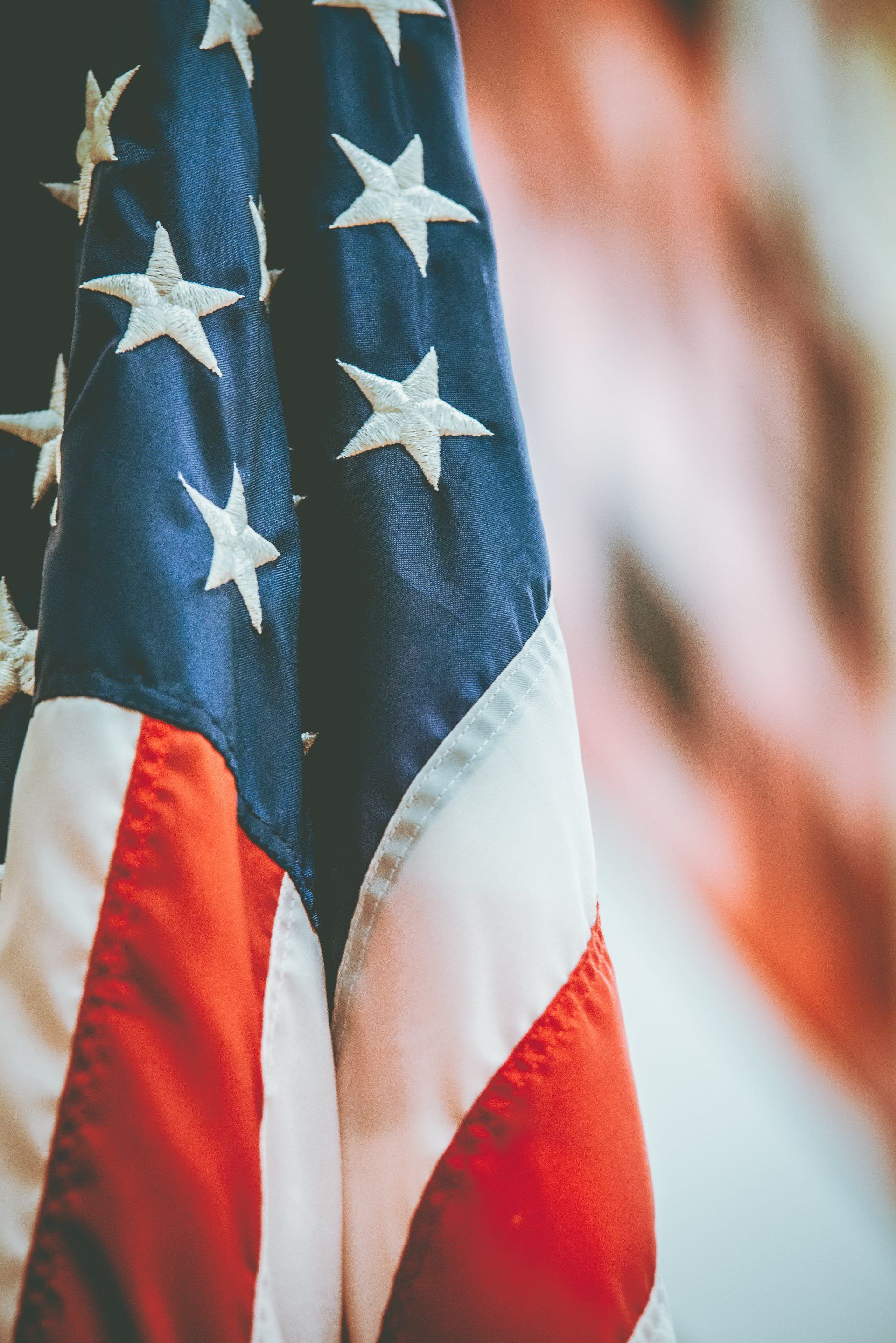 A close up of an american flag with stars on it.