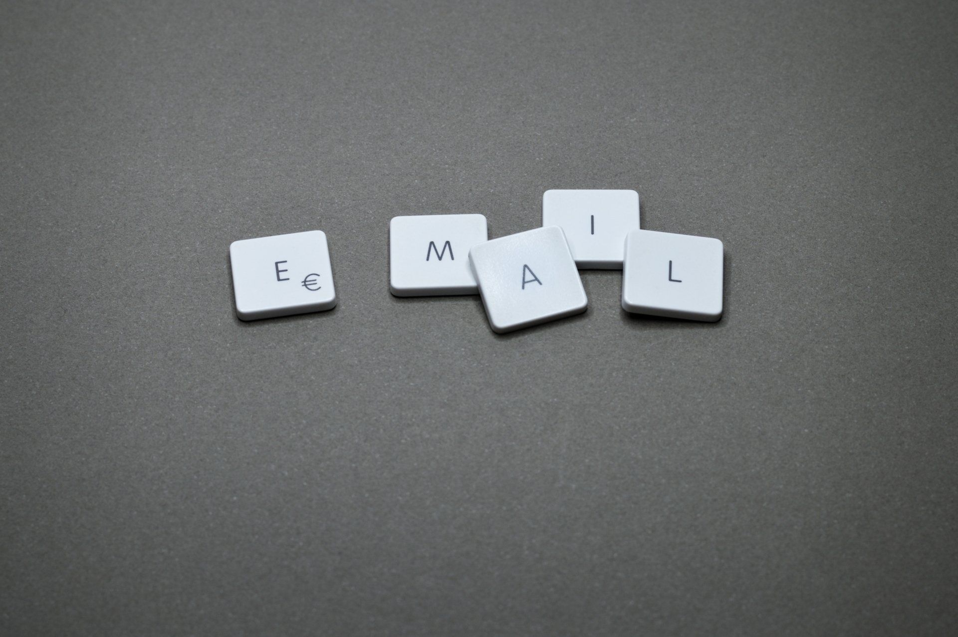 The letters e , g , h , i , and l are written on a keyboard.