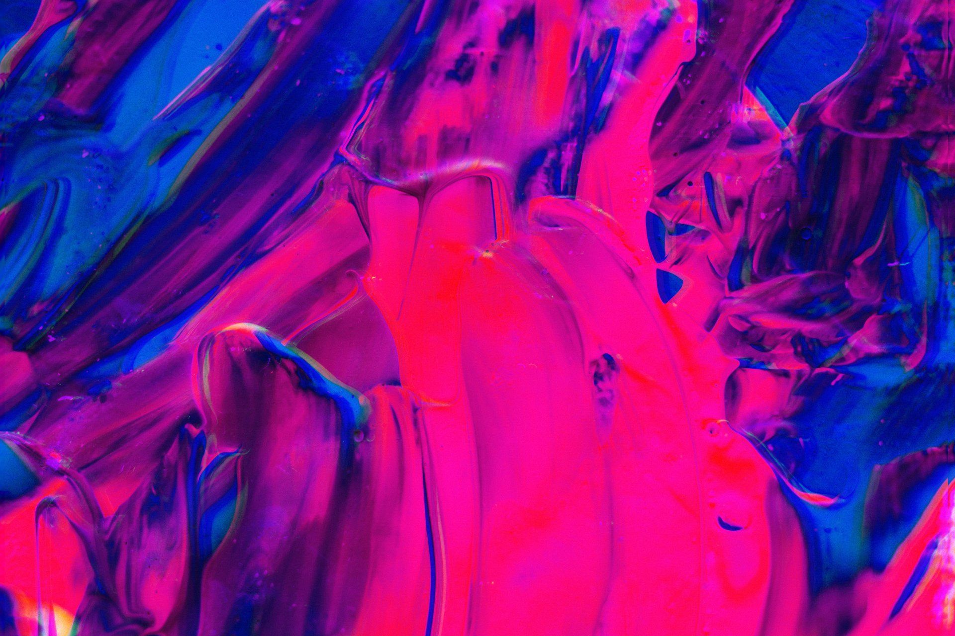 A close up of a pink and blue painting.