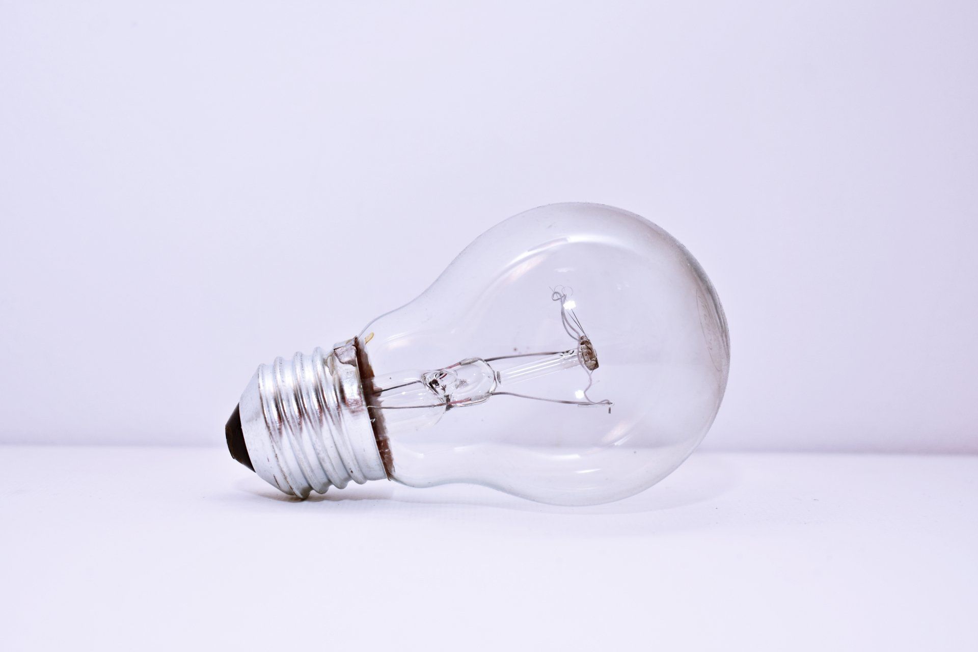 An energy-efficient light bulb symbolizing the option for residents to initiate an electric account for their rental property through the property management website, promoting sustainability and convenience.