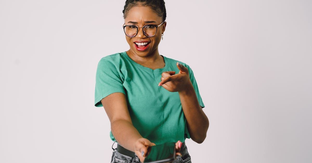A young lady holding a phone out to the camera and pointing to it as if to say call now!  Clicking this picture takes you to When Life Happens Call Christina Now!
