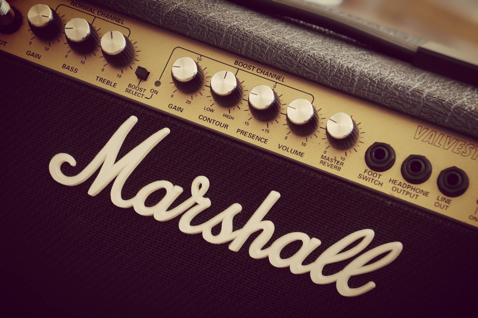 Black Guitar Amplifier with jack plugged in