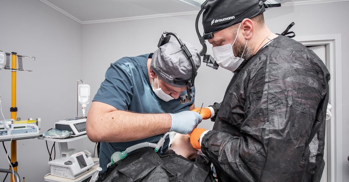 physicians performing an oral surgery in a hospital room