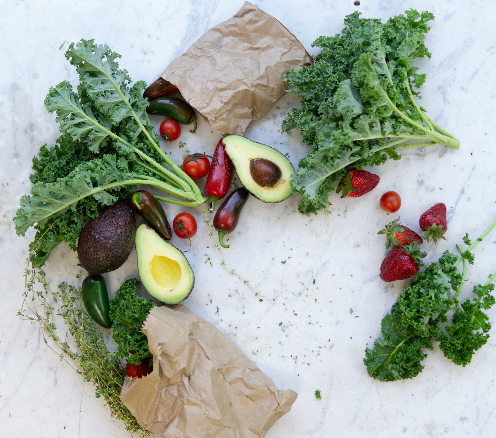 a variety of fruits and vegetables are on a table .