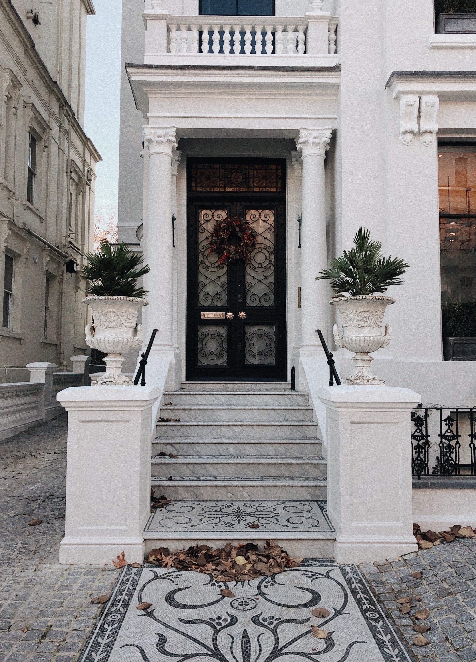 Luxury home exterior with elegant architecture and winter curb appeal.