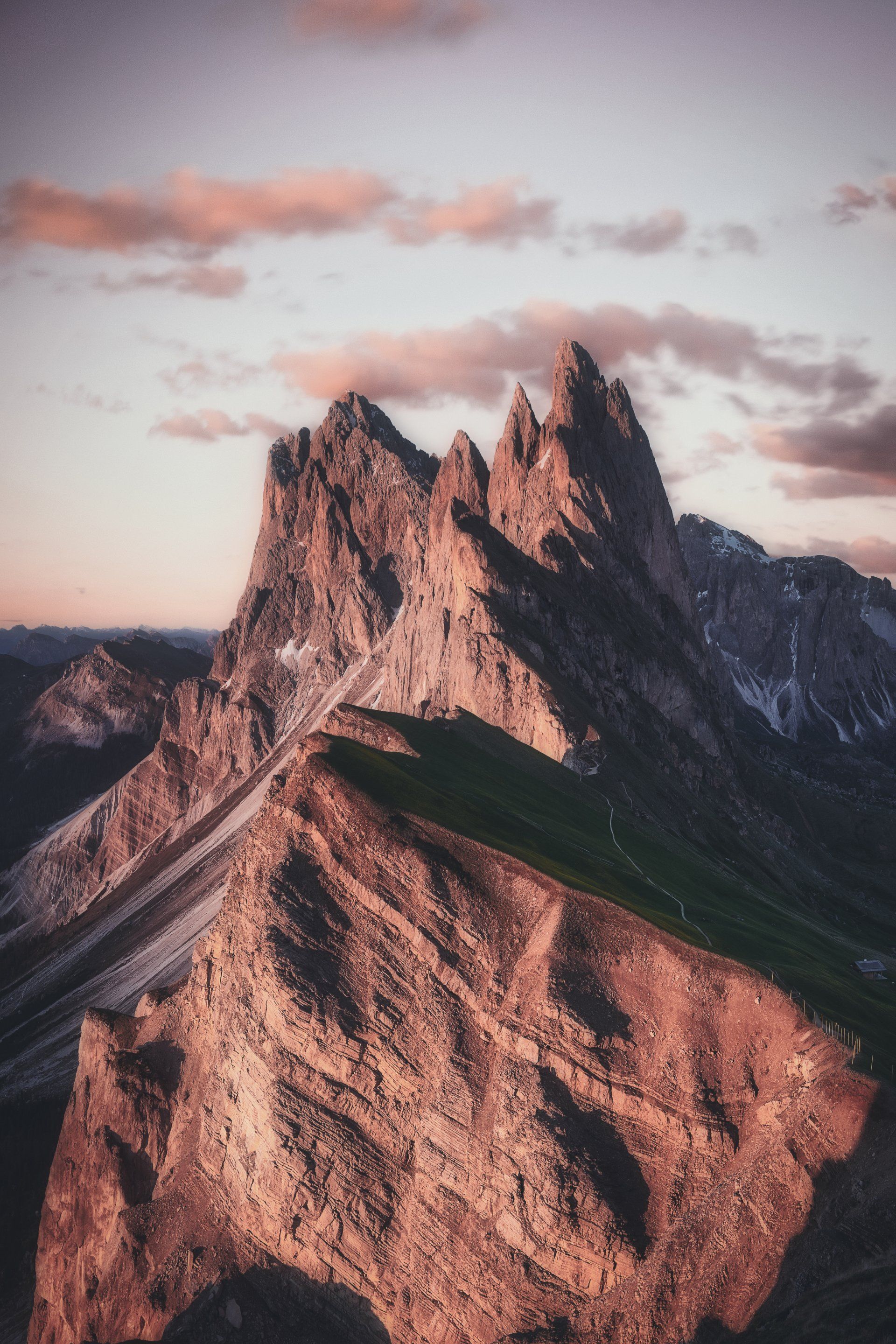 An aerial view of a mountain range at sunset.