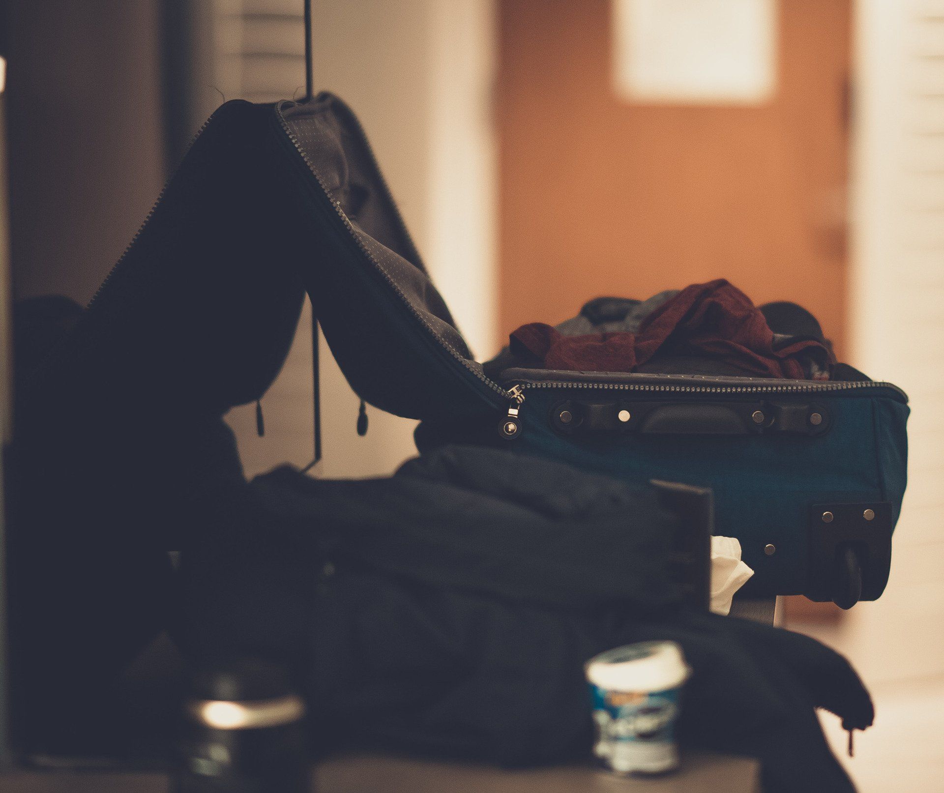 suitcase sitting open in a hotel room