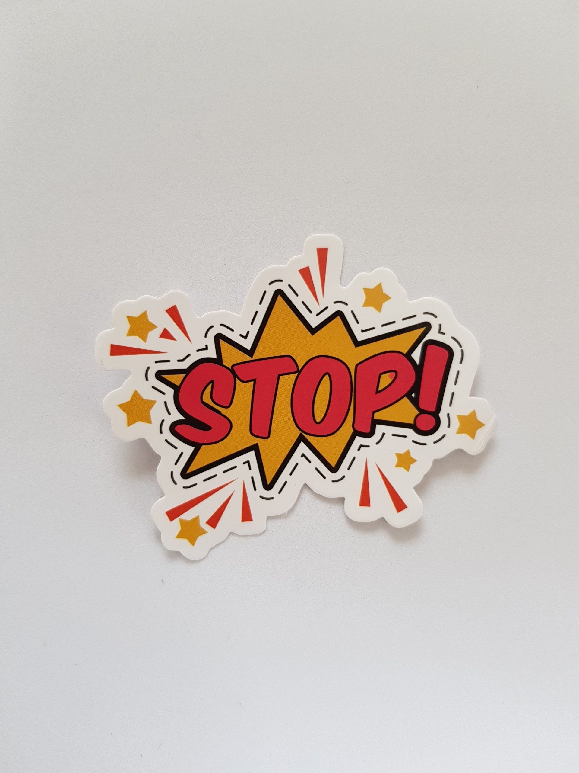 a sticker with the word stop on it