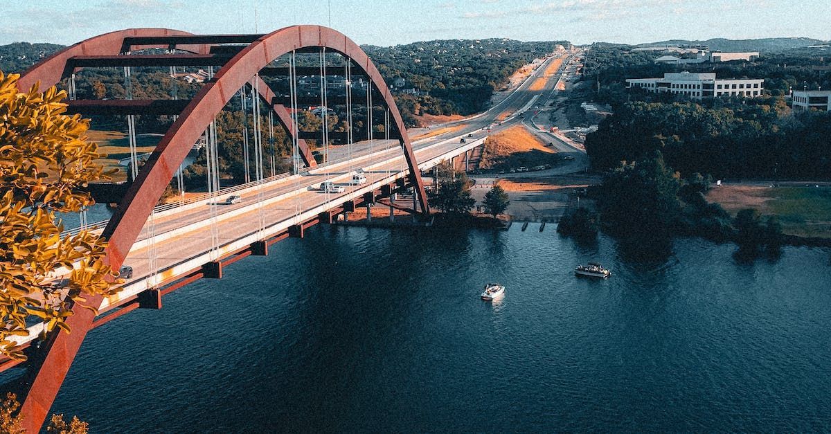 An aerial view of a bridge over a body of water.