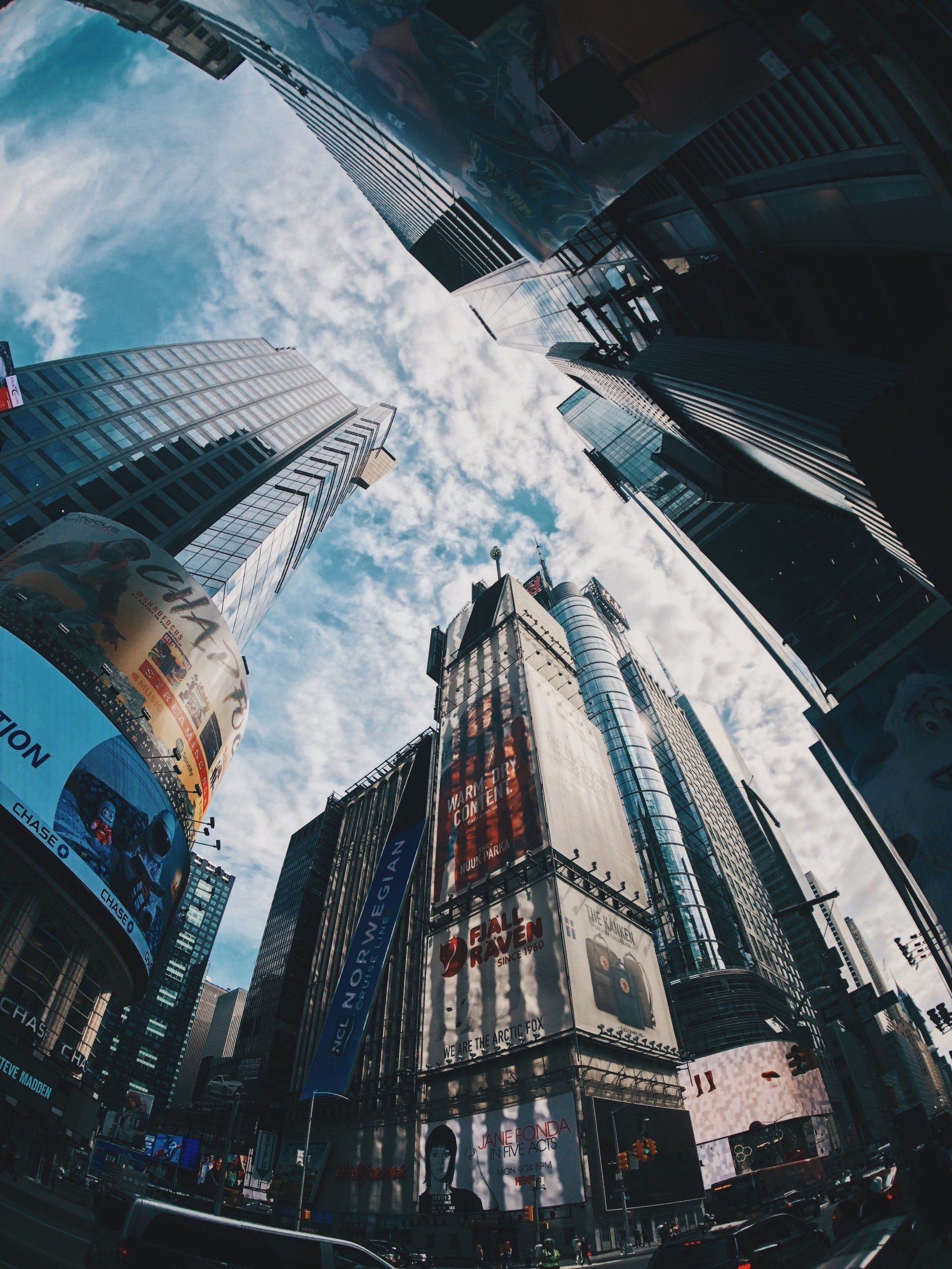 Looking up at a city skyline with a sign that says sony on it