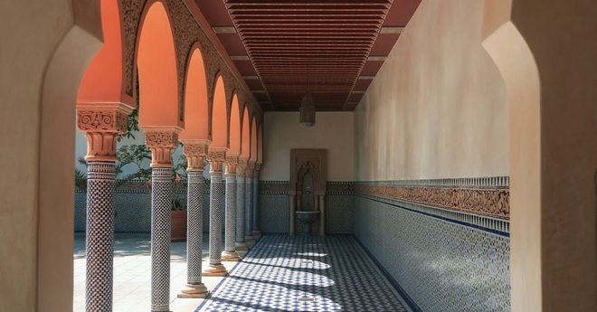 Islamic counseling setting with traditional architecture representing faith-based guidance