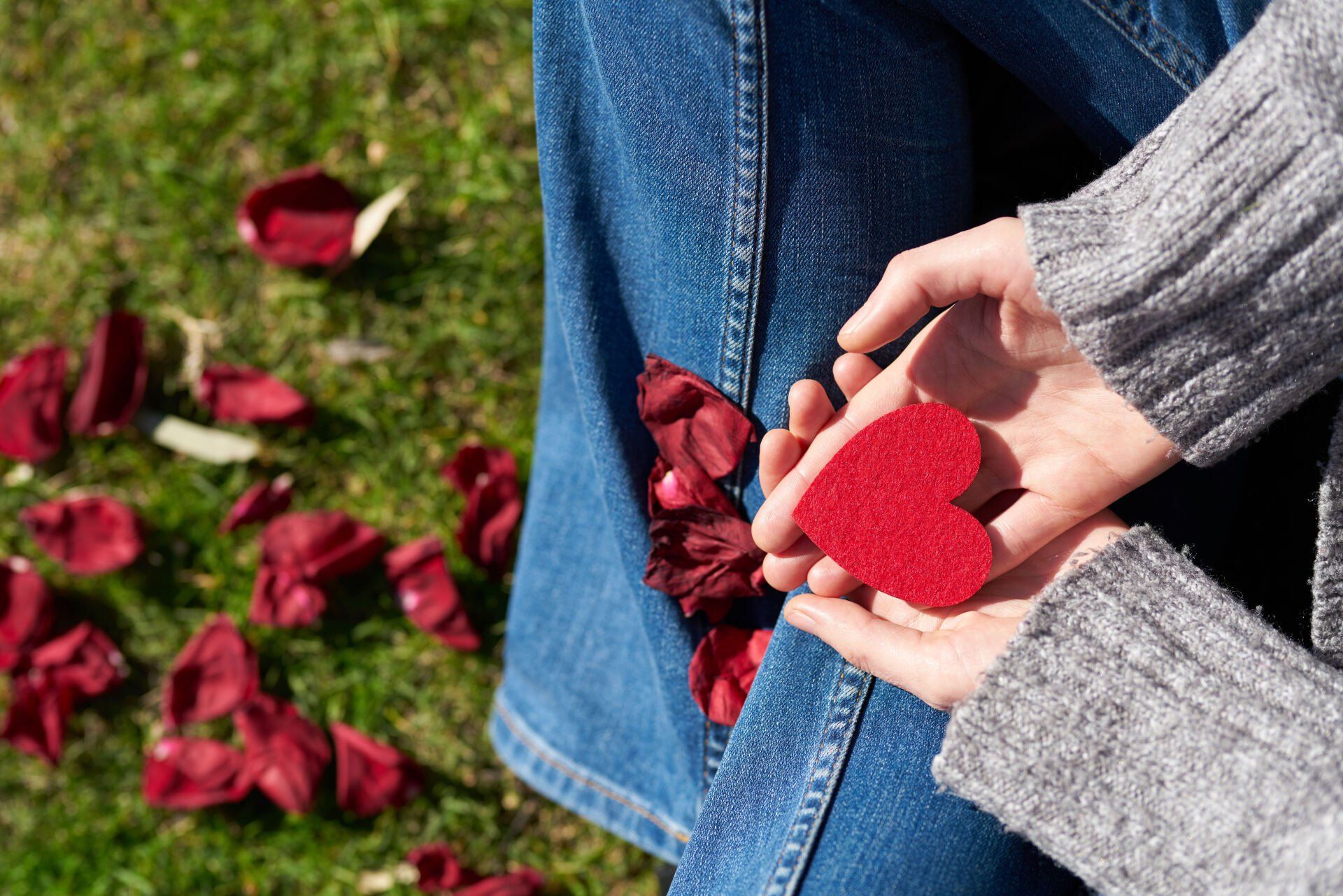 Woman Holding a Paper Shaped Heart