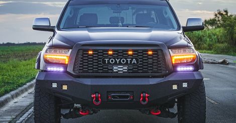 A toyota tundra is parked on the side of the road.
