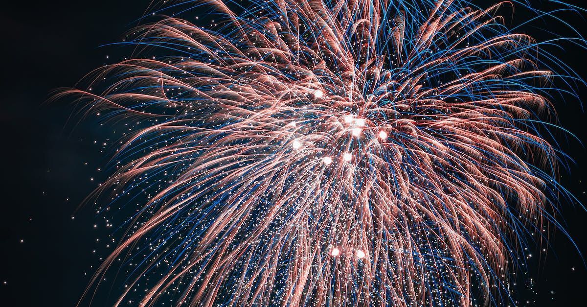 A close up of a fireworks display in the night sky.