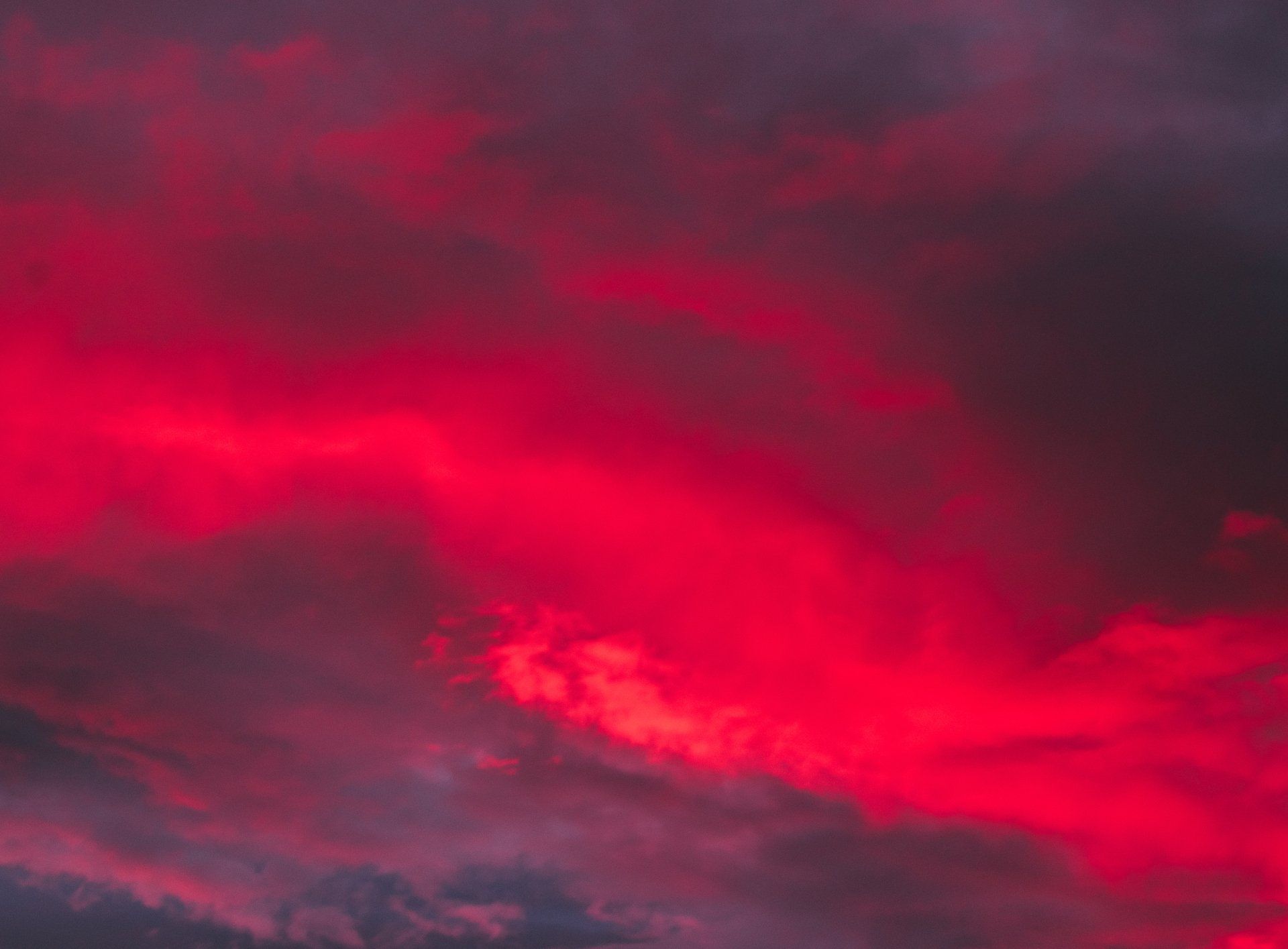 A sunset with red clouds in the sky