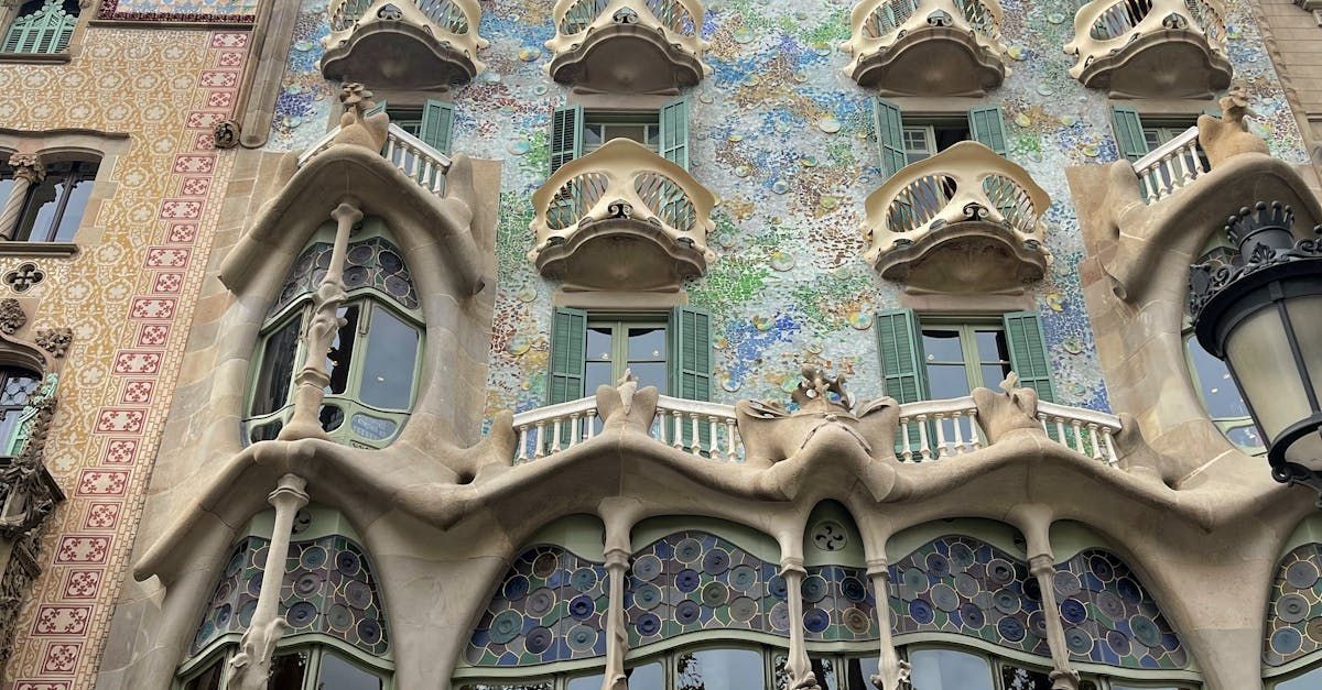 A building with a lot of windows and balconies on it.