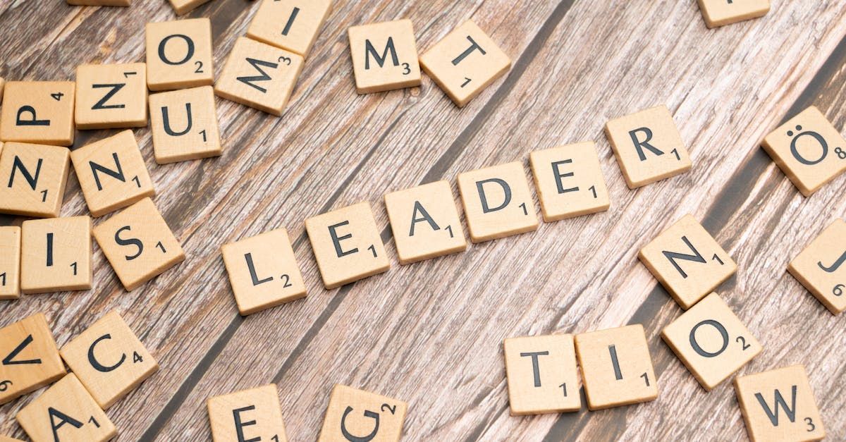 scrabble pieces spelling leader