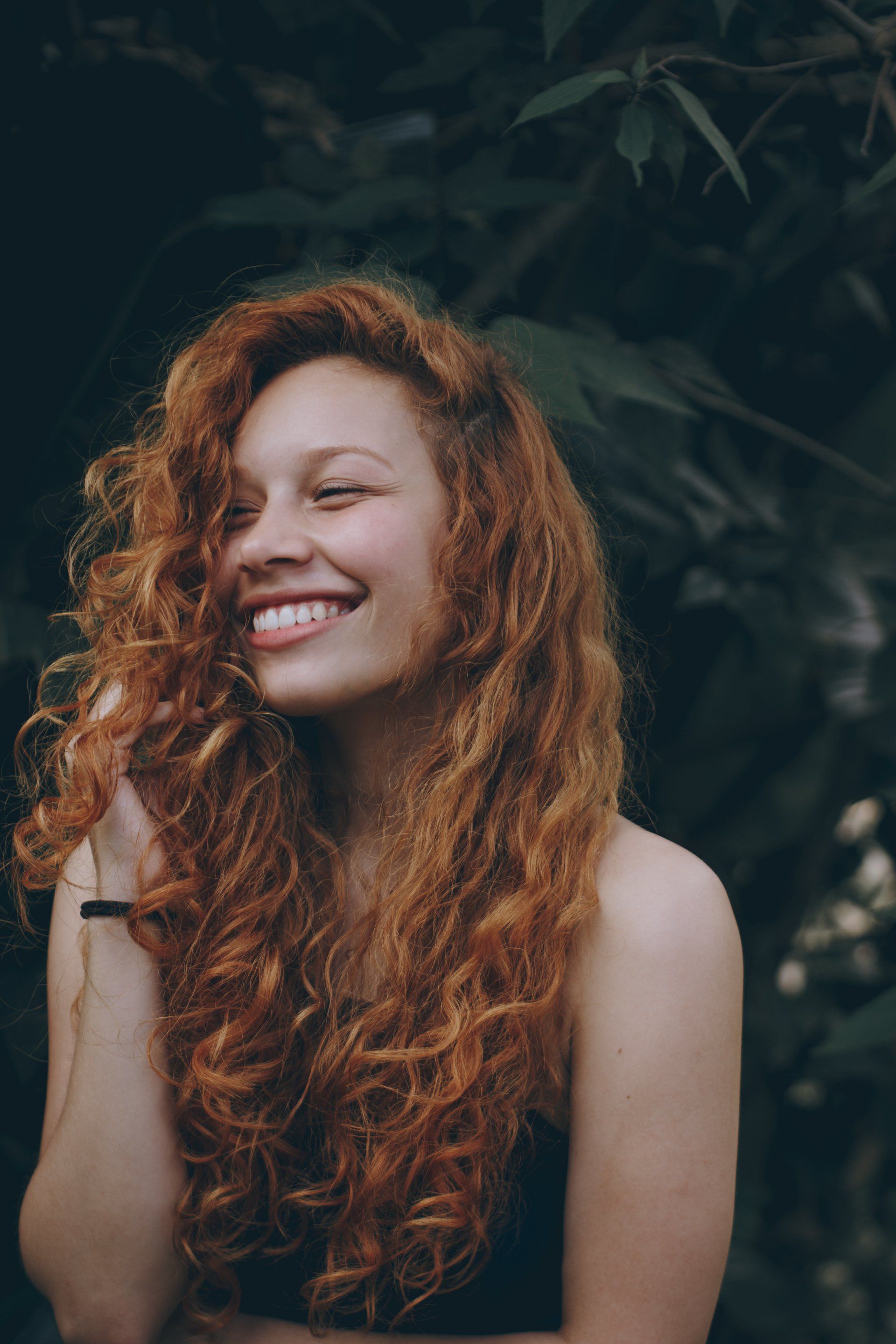 A woman with white teeth smiling