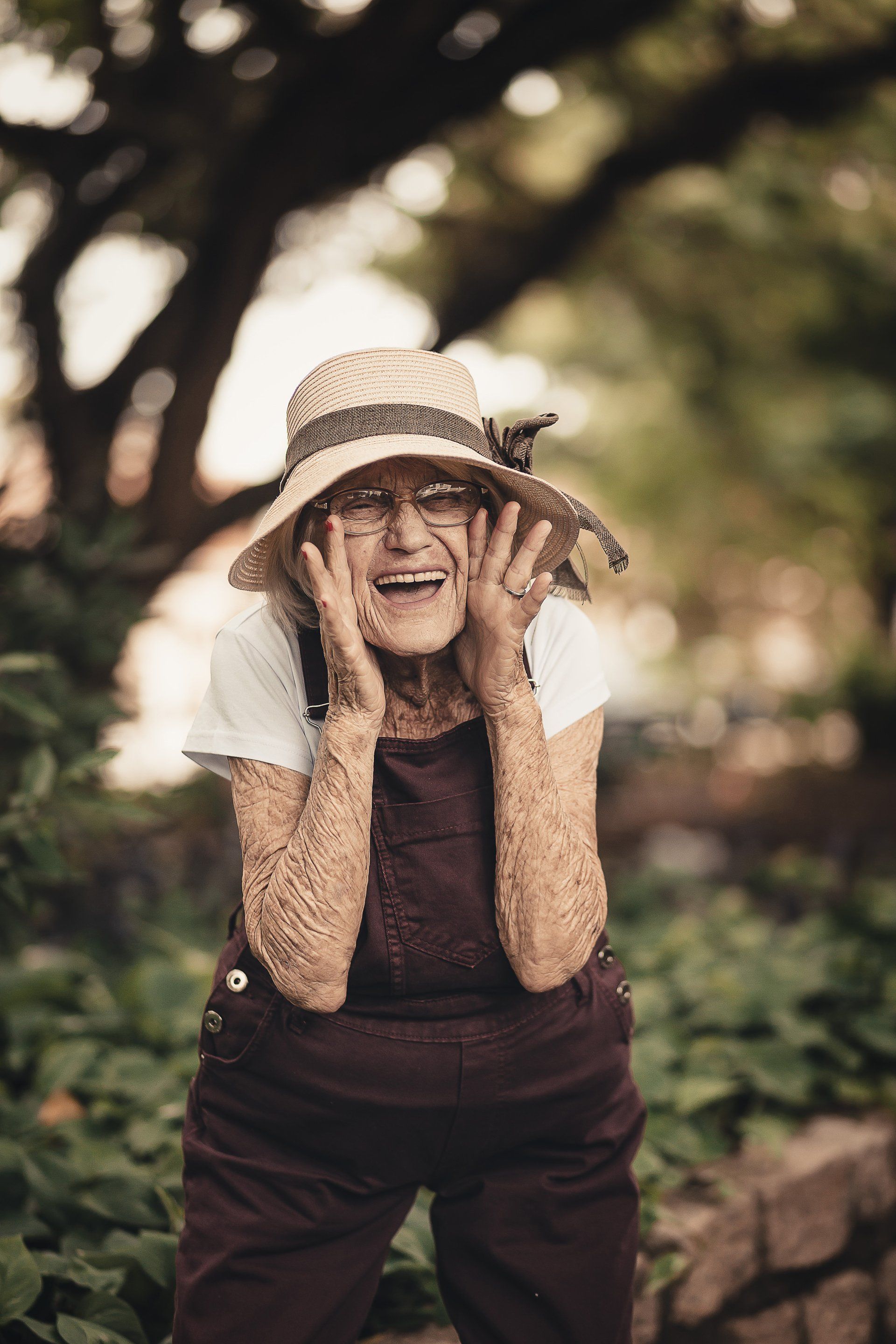 An Old Woman Smiling — The Denture Care Group Sunshine Coast in Caloundra, QLD