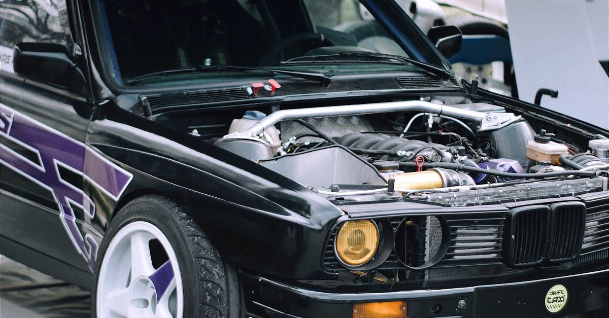 black car with its bonet open to check the issue of battery in Sutherland Shire