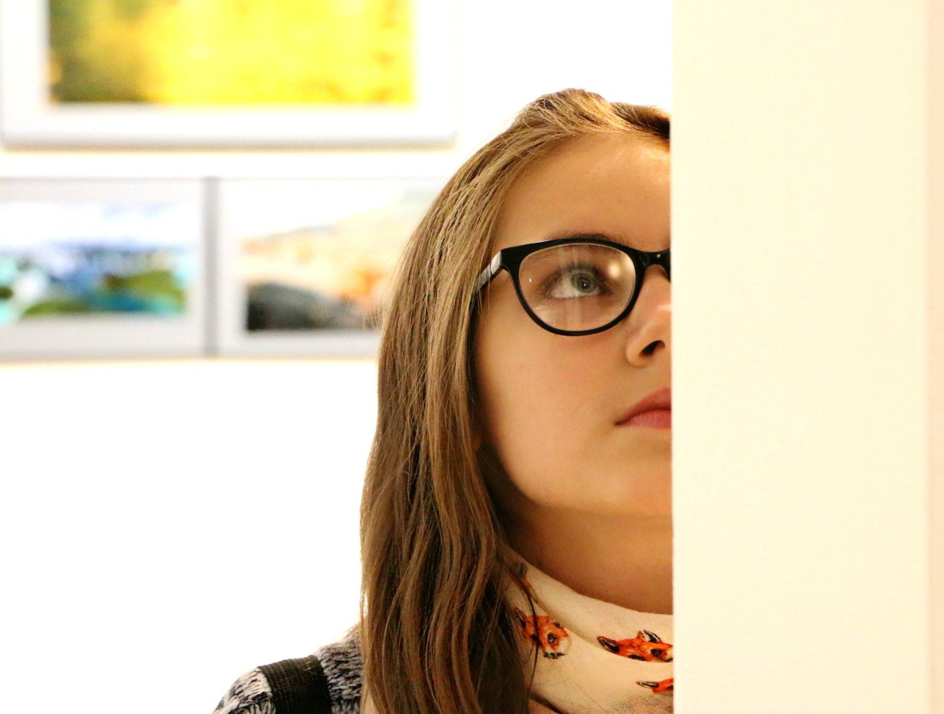 woman looking at art