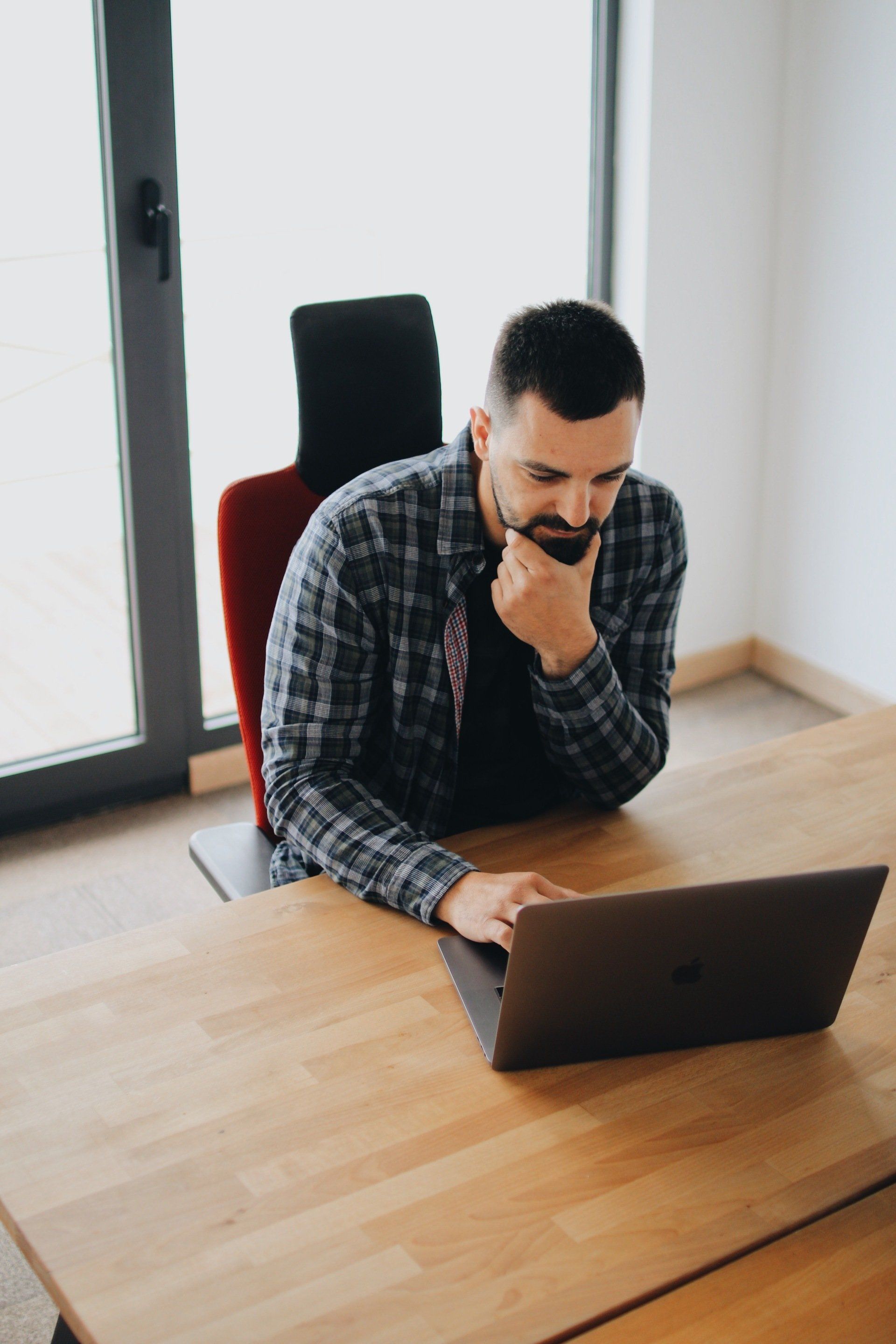 Virtual Assistant at laptop working for client