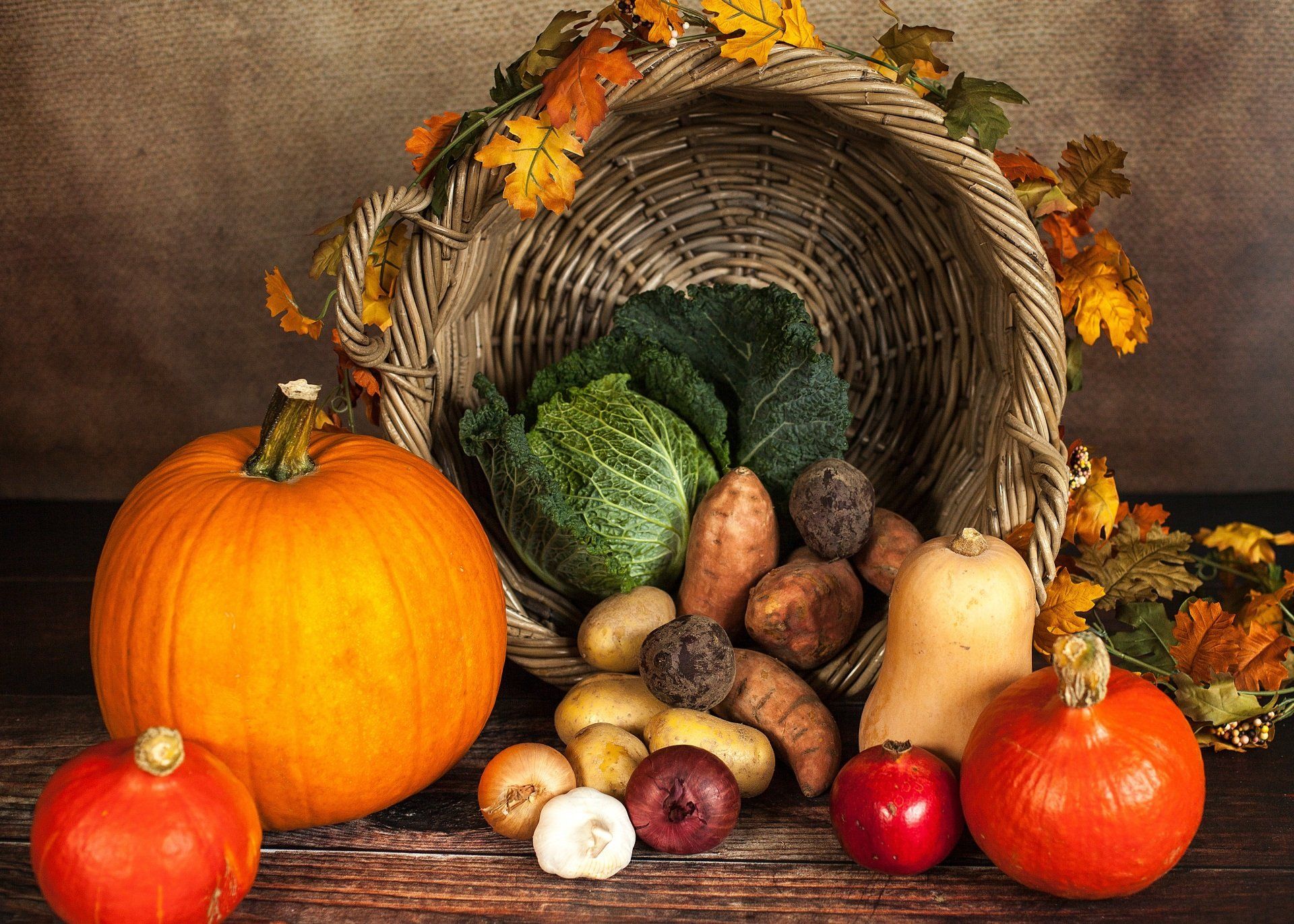 A cornucopia of fruits and vegetables on a wooden table