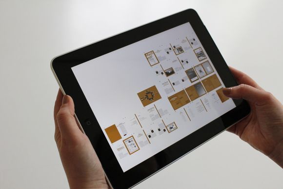 A person is holding a tablet in their hands