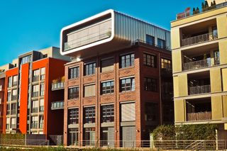 A brick building with a balcony on top of it