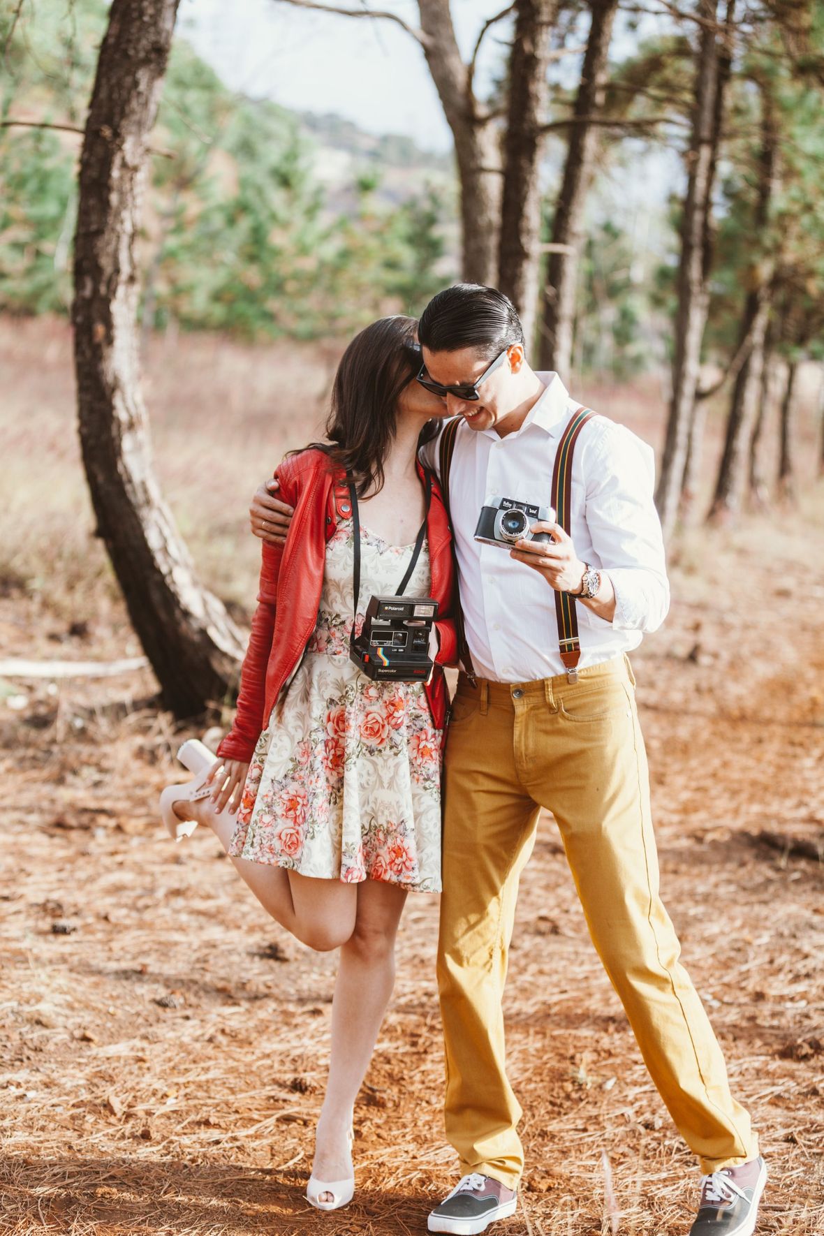 happy couple outdoors taking photos