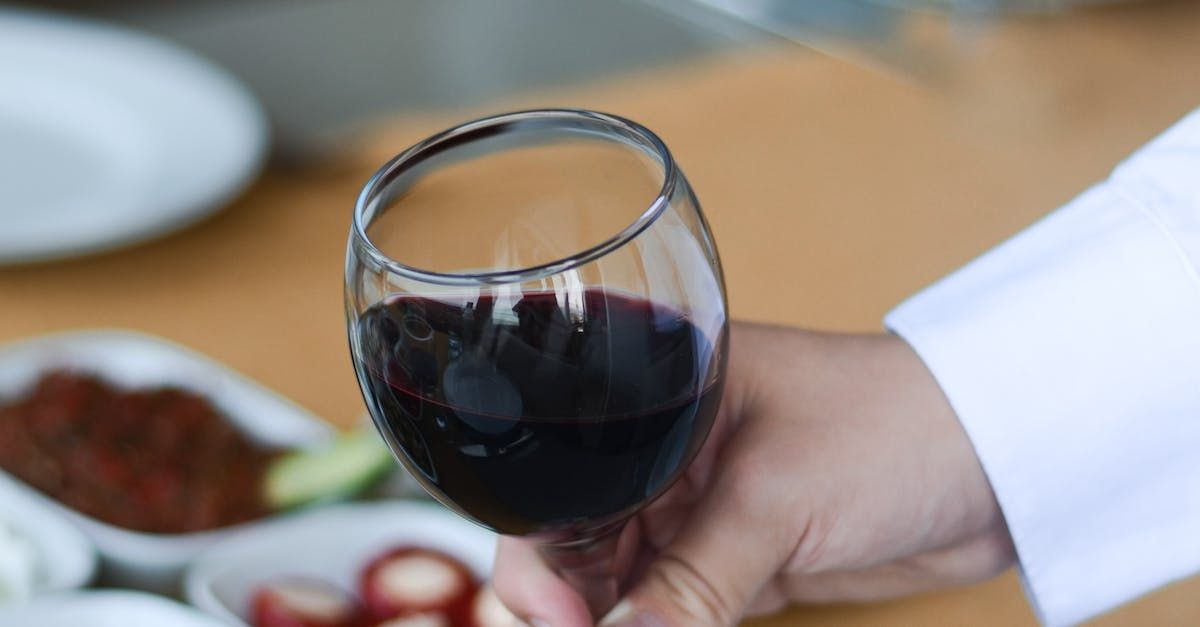 a row of wine glasses are lined up on a table .