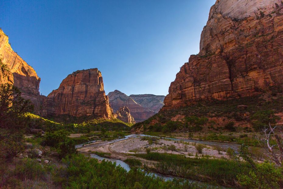 Zion-Towering red rocks with river winding through