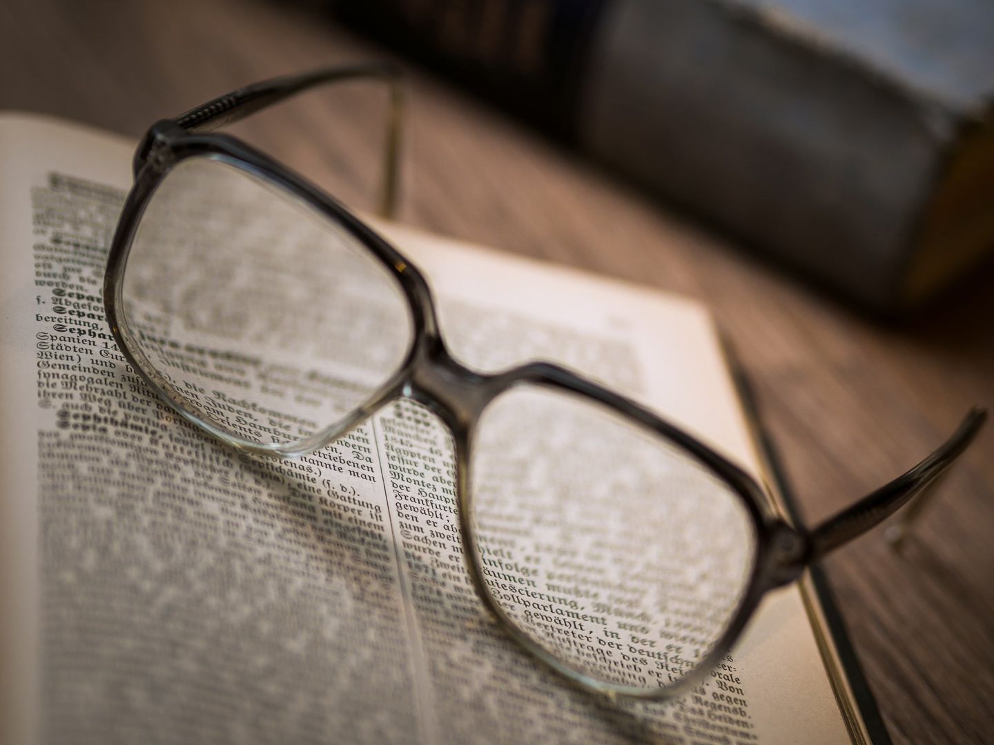 Glasses and book page